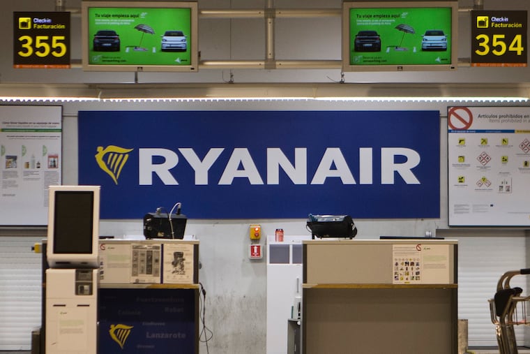 The Ryanair desk is seen, Aug. 10, 2018, at the Barajas airport in Madrid, Spain. The flight on which a window broke was Malta Air, a subsidiary of Ryanair.