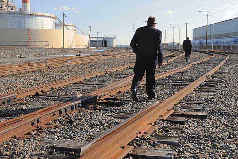 Jack Galloway, the driving force of the $68 million project, walks the tracks at Exelon's old coal plant. TOM GRALISH / Staff Photographer
