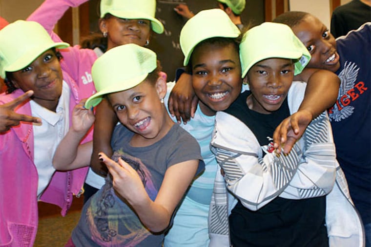 Fourth graders at Samuel Powel School get ready for Sunday's show, "CityStep Presents: Intramural." In preparing for it, Penn students and pupils at five city elementary schools get a look at each other's lives. (Photo by Beth Kephart)