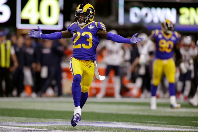 Nickell Robey-Coleman celebrates after teammate Cory Littleton intercepted Tom Brady in the first quarter.