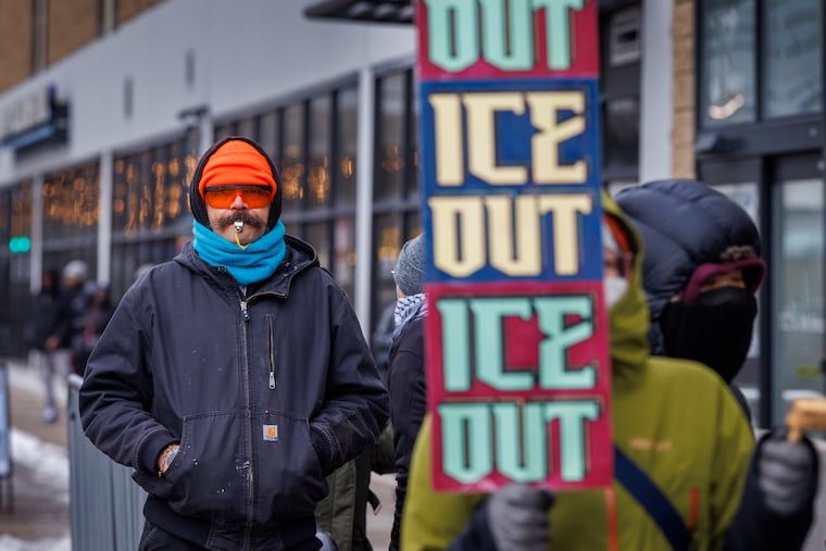 Huston West of Philadelphia blows a whistle during a protest by No Ice Philly outside the U.S. Immigration and Customs Enforcement office at 114 N. Eighth St. in Center City.