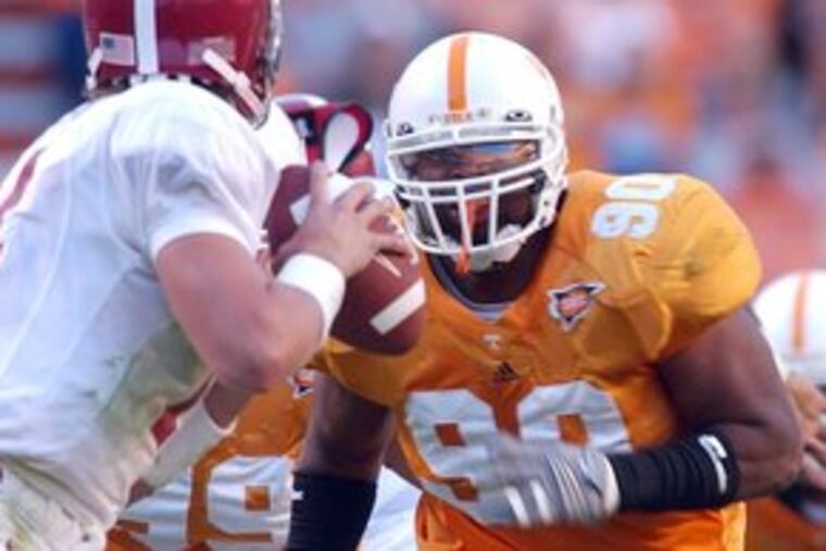 Turk McBride, a Woodrow Wilson grad, chases Alabama QB John Parker Wilson during Tennessee's 2006 victory over the Crimson Tide.