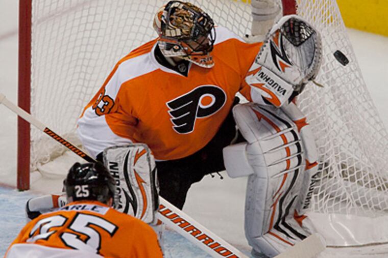 Brian Boucher made 33 saves on 37 shots to help the Flyers on the way to an OT win. (Ed Hille / Staff Photographer)