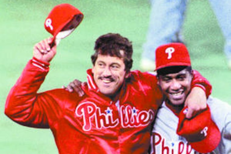 SEPTEMBER 28, 1993-- PHILLIES AT PIRATES--Coach John Vukovich hugs Mariano Duncan as they leave the field after clinching the NL East division title. Duncan hit a grand slam home run in the 7th inning.PHOTO BY JERRY LODRIGUSS / THE INQUIRER