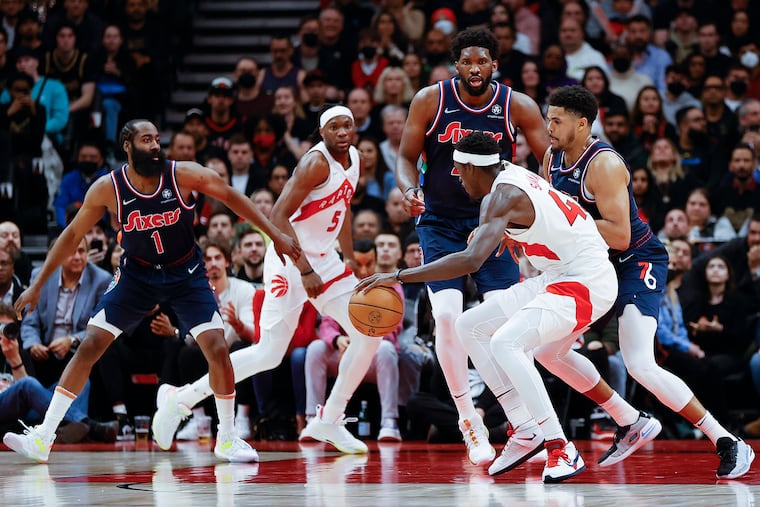 Sixers forward Tobias Harris, center Joel Embiid and guard James Harden defend Toronto Raptors forward Pascal Siakam during game three of the first-round Eastern Conference playoffs on Wednesday, April 20, 2022 in Toronto.
