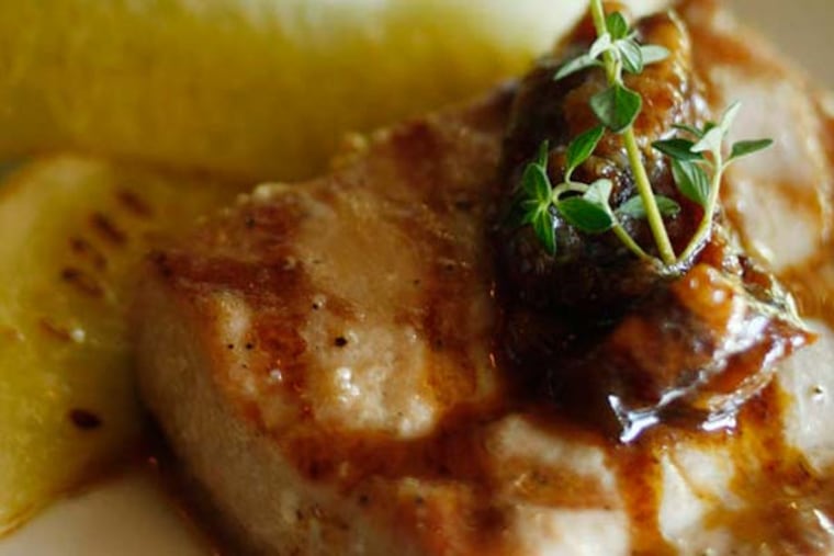 Grilling seafood can be intimidating but with a few tricks and a little trial and error great results can be had. A grilled salmon and summer salad dish is served at 18 Seaboard in Raleigh, North Carolina. (Juli Leonard/Raleigh News & Observer/MCT)