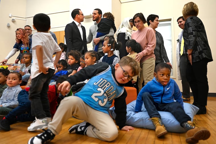 Gov. Josh Shapiro talks with Quinn Howard, who has a child in day care at the YWCA in York, Pa. Sen. Bob Casey is introducing a bill that would expand the federal Child and Dependent Care Tax Credit. Gov. Shapiro increased the state tax credit last year.