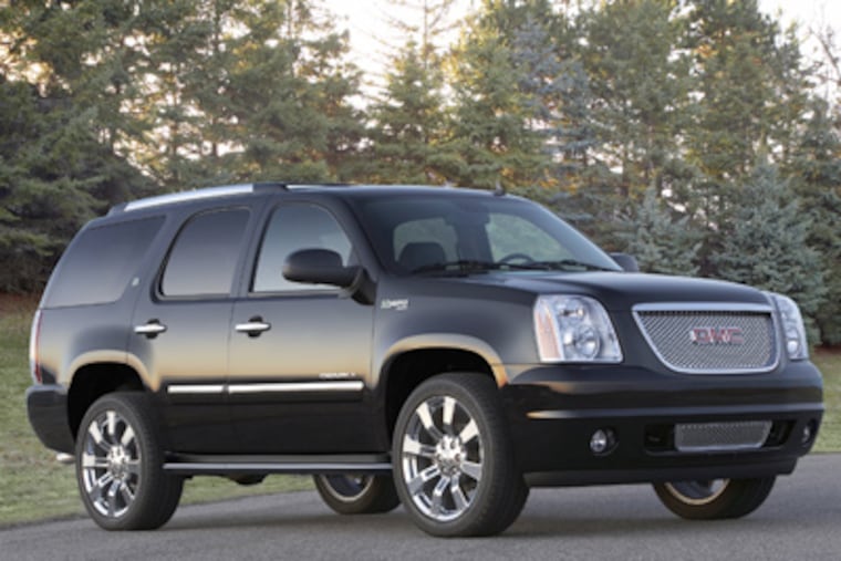 The 2011 GMC Yukon Denali Hybrid handles well in a strong storm, but it has some shortcomings — such as space.