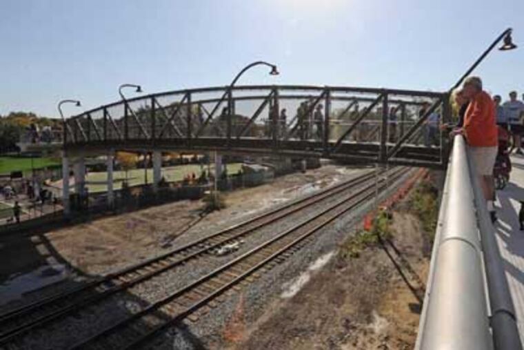Dedication of the new bridge of the Schuykill River on Oct. 20, 2012. Here, folks try out the bridge. APRIL SAUL / Staff Photographer