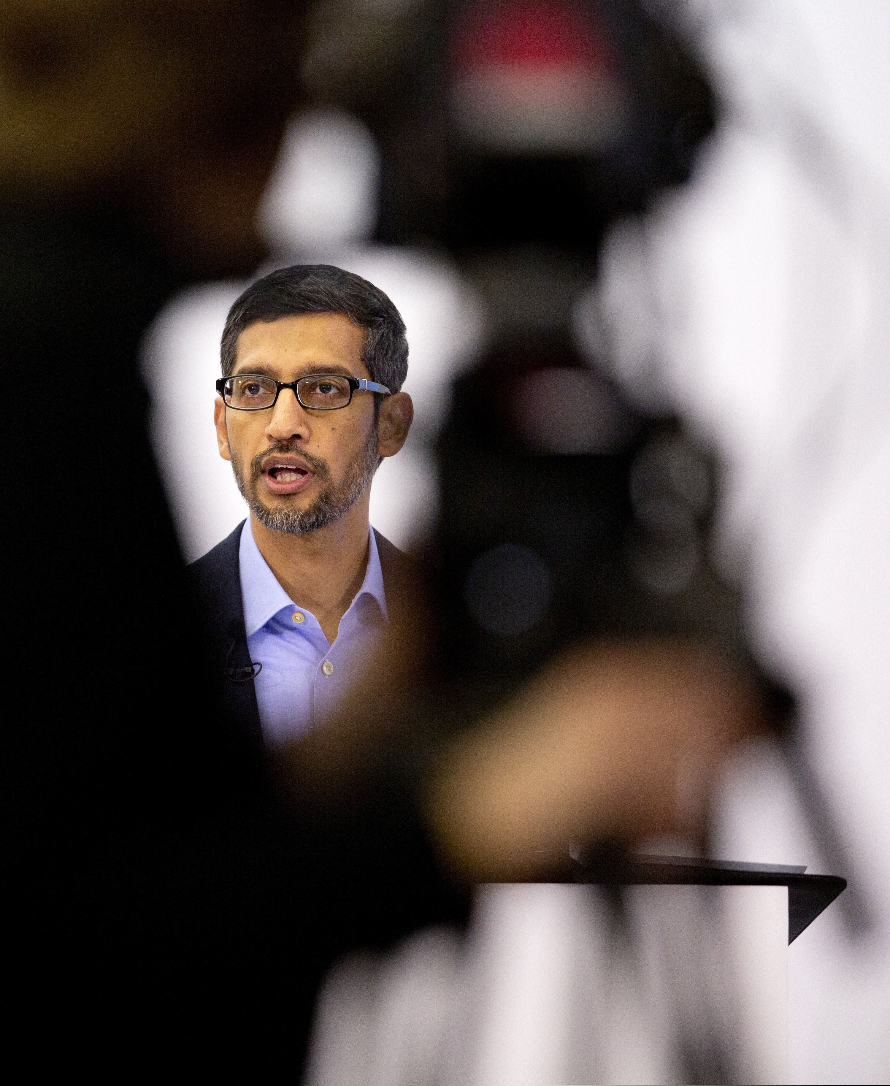 Google's chief executive Sundar Pichai addresses the audience during an event on artificial intelligence at the Square in Brussels, Monday, Jan. 20, 2020. Google's chief executive called Monday for a balanced approach to regulating artificial intelligence, telling a European audience that the technology brings benefits but also negative consequences.