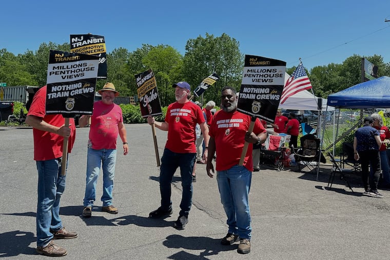 Members of the New Jersey Transit locomotive engineers union striking picket outside a rail yard in Morrisville, Pa., on May 17, 2025.