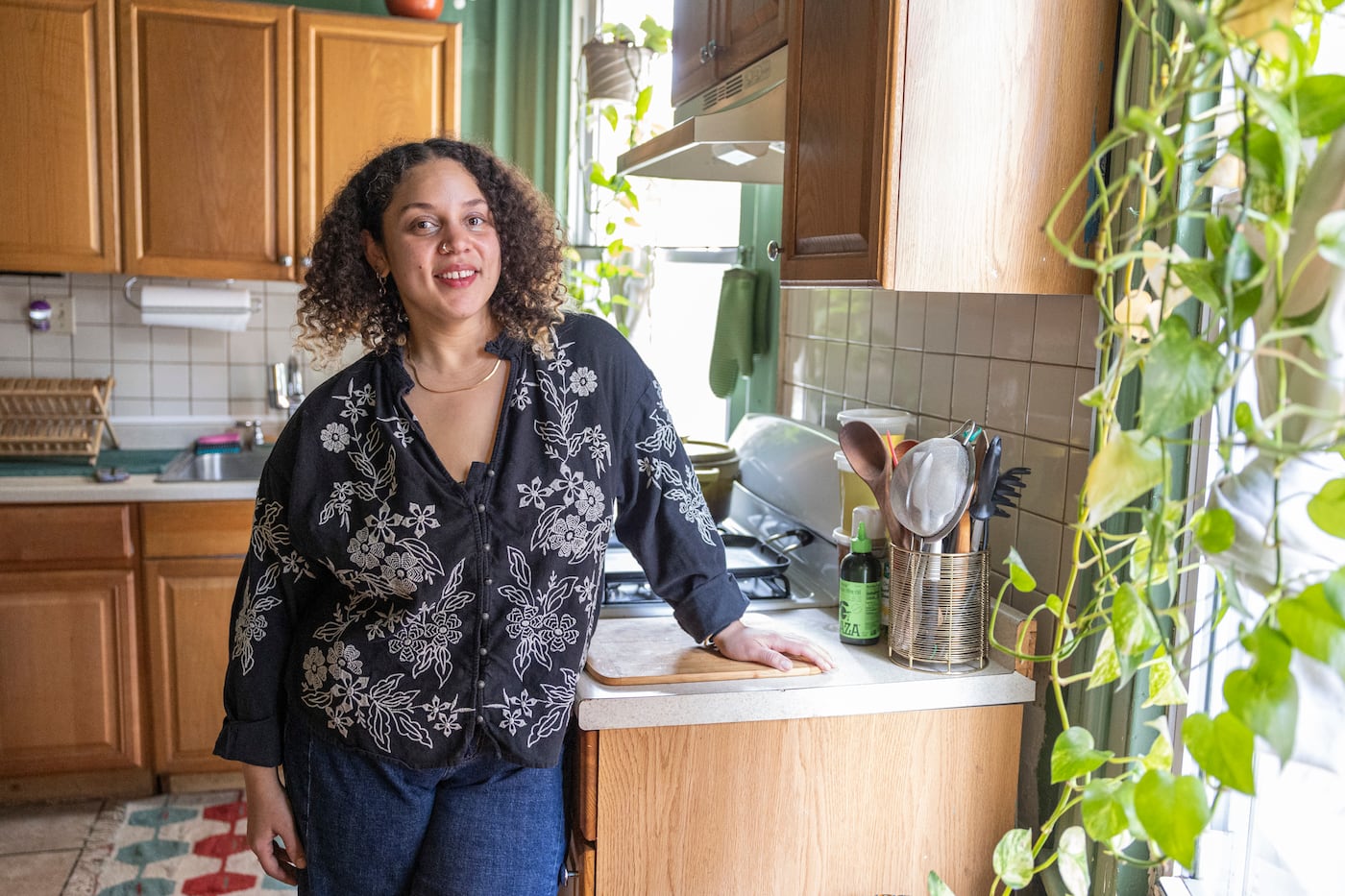 Huston hung leafy plants around the kitchen to complement the green walls.