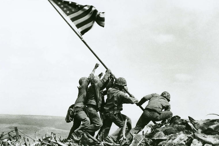 Joe Rosenthal's image of Marines raising the American flag on Iwo Jima, which won a Pulitzer in 1945, depicts war without showing violence.