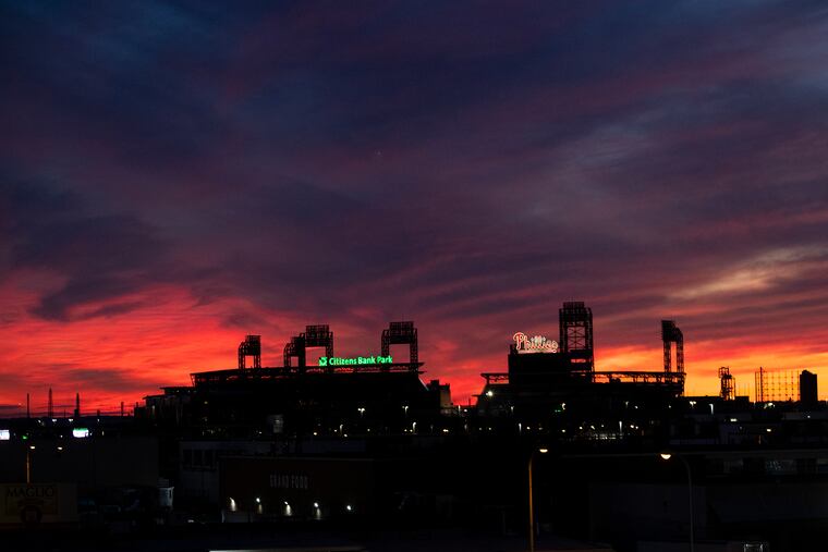 A sunset over Citizens Bank Park. If Major League Baseball games aren’t played this year, team owners stand to lose nearly $4 billion.