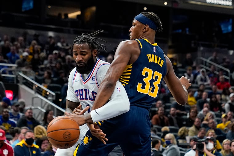 Indiana Pacers center Myles Turner (33) ties up Philadelphia 76ers center Andre Drummond (1) during the first half of an NBA basketball game in Indianapolis, Saturday, Nov. 13, 2021.