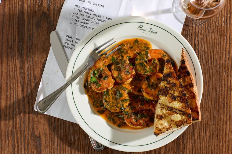 Pine Street Grill's shrimp pil pil is inspired by Dmitri's, whose original recipe is printed alongside the dish.