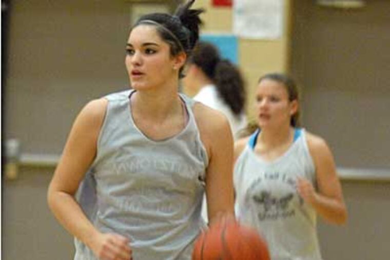 Downingtown East's Ro Gentry, who has signed with Rider University, is seen moving the ball up the court during practice. (Ron Tarver / Staff Photographer)