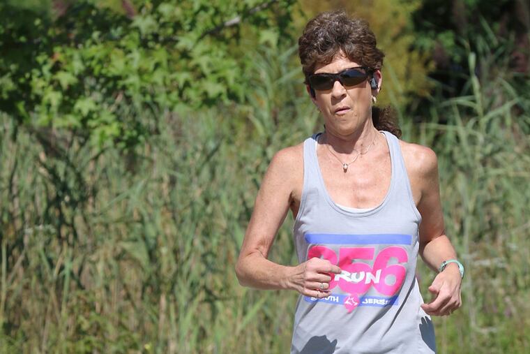 Eleanor Beason, a runner who has dealt with Achilles tendinopathy, trains at Lindenwold Memorial Park.
