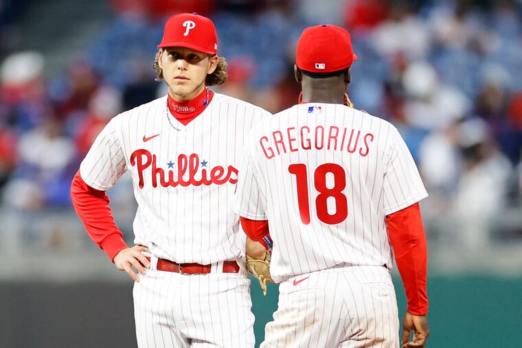 Phillies third baseman Alec Bohm with teammate Didi Gregorius during a break against the New York Mets on Monday in Philadelphia.