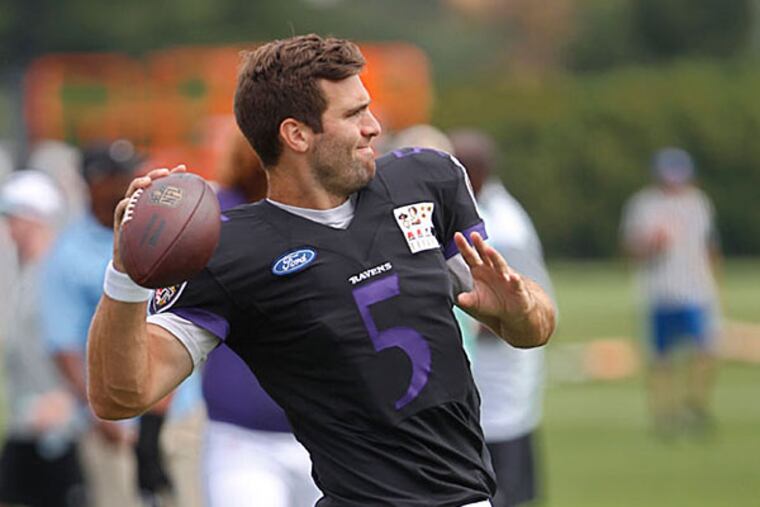 Baltimore Raven quarterback #5, Joe Flacco, warms up before the Ravens and Eagles combined practice on Wednesday.