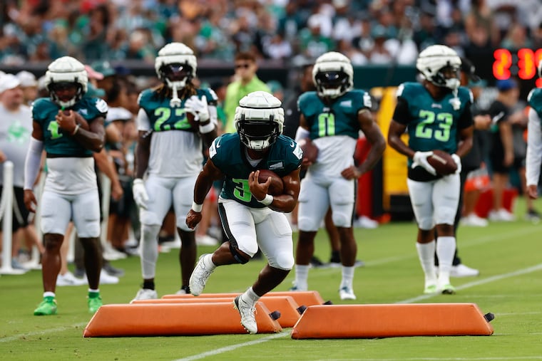 Boston Scott runs with the football during public training camp practice at Lincoln Financial Field on Sunday, August 6.