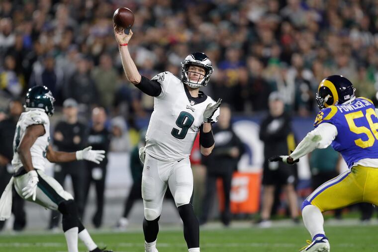 Nick Foles throws past Rams linebacker Dante Fowler during the second quarter on Sunday.