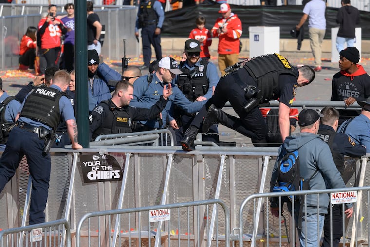 Law enforcement personnel clear the area around Union Station following a shooting at the Kansas City Chiefs NFL football Super Bowl celebration in Kansas City, Mo., on Feb. 14.