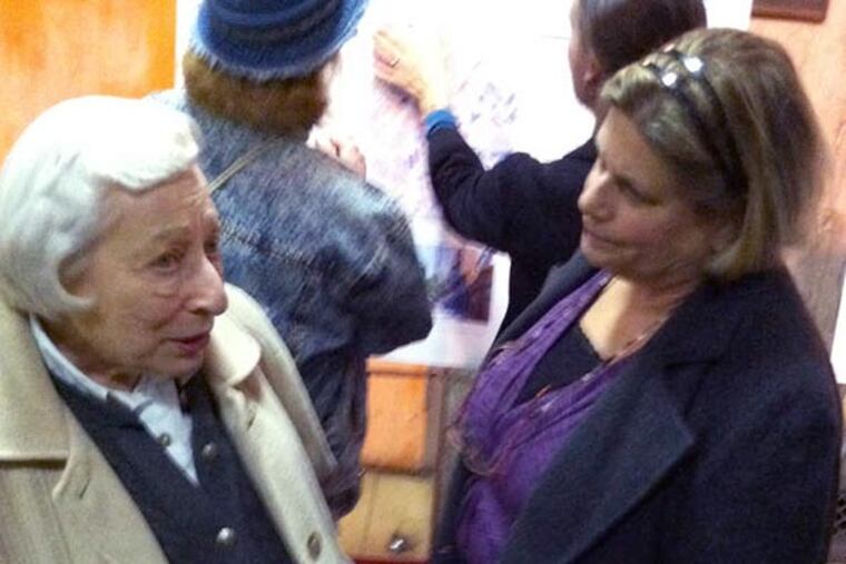 Northeast Philadelphia residents Lorraine Brill (left) and Sue Feola discuss the City Planning Commission's revitalization plans for Fox Chase and Five Points at last night's meeting. (Dan Geringer/Staff photo)