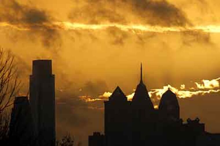 A Philadelphia sunrise, as seen from Lancaster Avenue and 59th Street, casting an orange glow Nov. 29, 2011. (Michael S. Wirtz / Staff Photographer)