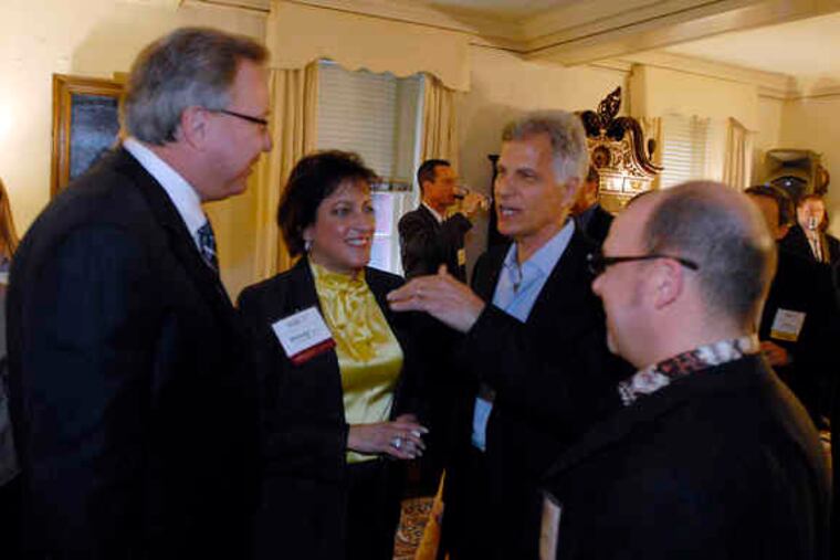 At a Business Clubs America social at the Union League in Phila., 170 people, including Wendy Monaco, of Allied Mortgage Group, networked and got pointers from Olympic gold medalist/businessman Mark Spitz (center). Former Eagle Ron Jaworski (left) quarterbacks the BCA chapter here.