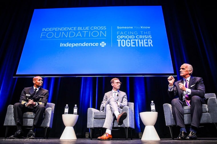 U.S. Surgeon General Jerome Adams, recovery advocate Luke Gorman and Independence Blue Cross CEO Dan Hilferty speak at a panel at an IBX opioid conference in Philadelphia Tuesday.