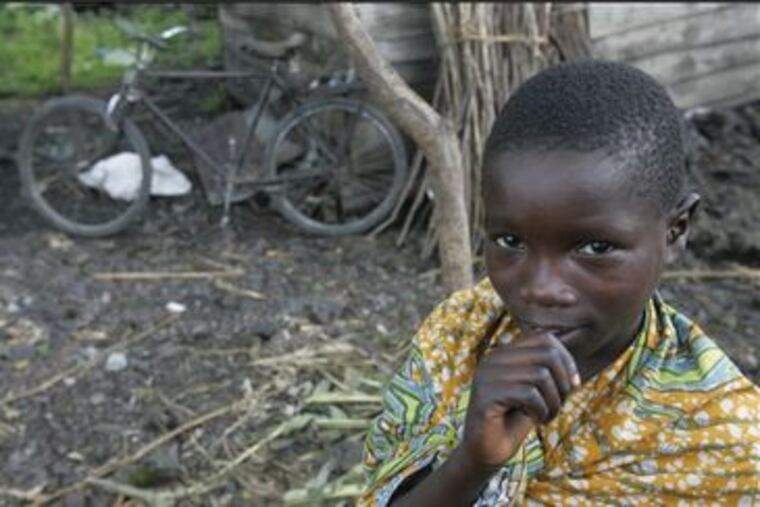 Rebecca Nyiringindi, 10, was separated from her parents during fighting Oct. 27 and went to Congo's Kibati camp. A Save the Children representative interviewed her yesterday to help reunite the family.