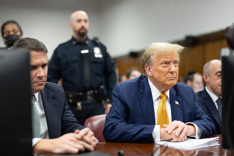 Former President Donald Trump appears at Manhattan criminal court before his trial in New York, Tuesday.