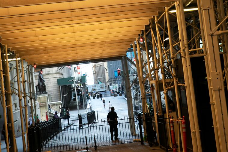 Construction scaffolding covers a portion of Wall Street next to the New York Stock Exchange on June 16, 2020. Stocks have been a bright spot amid the pandemic. But Congress needs to act quickly to keep the recovery going. (AP Photo/Mark Lennihan)