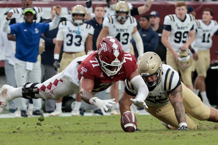 Temple’s Giakoby Hills dives for a fumble that was eventually recovered by Navy on Oct. 11.