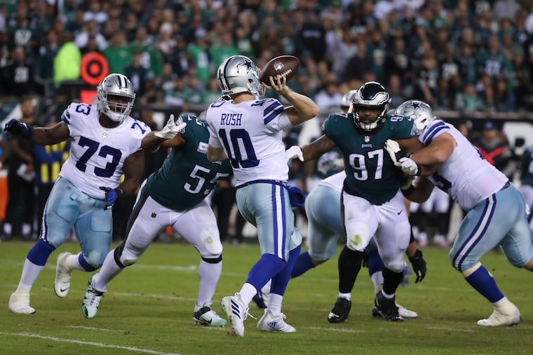 Philadelphia Eagles defensive end Brandon Graham (55) and Philadelphia Eagles defensive tackle Javon Hargrave (97) put pressure on Dallas Cowboys quarterback Cooper Rush (10) resulting in an interception at Lincoln Financial Field in Philadelphia, Pa. on Sunday, October 16, 2022.