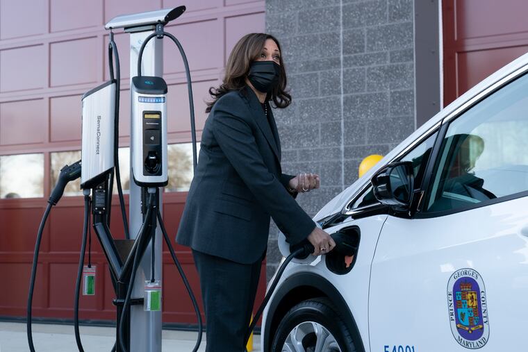 Vice President Kamala Harris charges an electric vehicle in one of the charging stations during her tour of the Brandywine Maintenance Facility in Prince George's County, Md., on Monday.