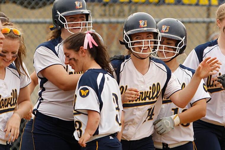 Unionville gathers around Madi Ross after her solo HR. West Chester
Henderson at Unionville in softball on Friday, May 9, 2014. ( RON
CORTES / Staff Photographer ).