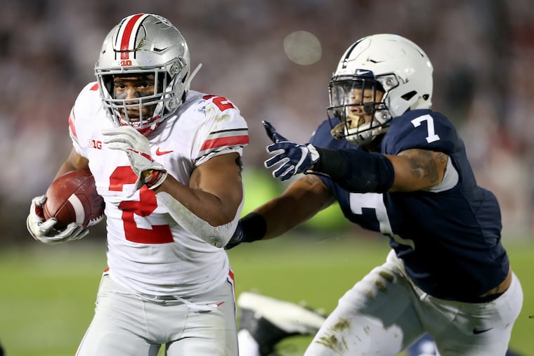 Ohio State running back J.K. Dobbins left scores past Penn State linebacker Koa Farmer during Penn State's loss to Ohio State on Saturday.