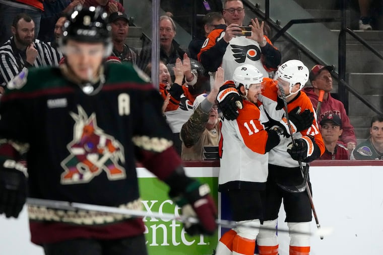 Philadelphia Flyers right wing Travis Konecny (11) celebrates after his goal against the Arizona Coyotes with Flyers center Scott Laughton (21) on Dec. 7.