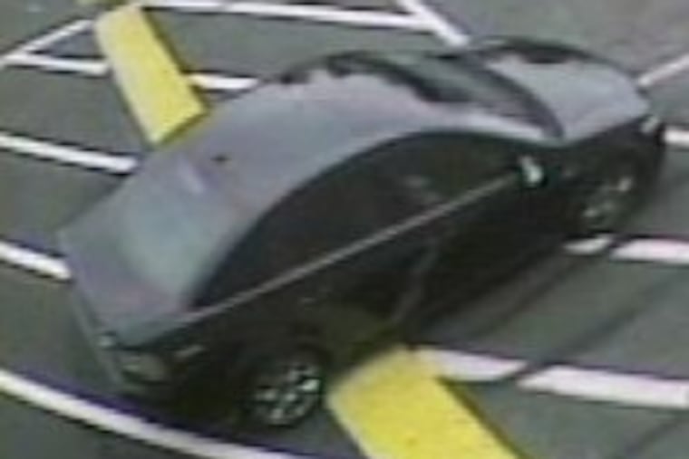 The killer's Acura TL, which he parked at the Turf Club at the Roosevelt Mall, in a surveillance image distributed by police.