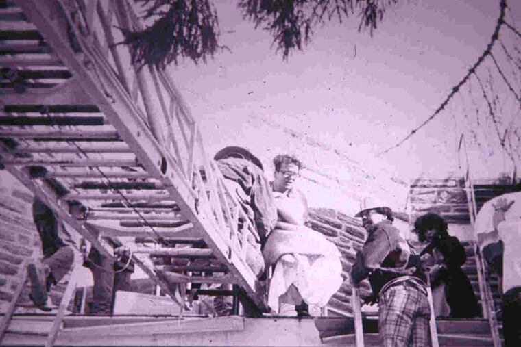 A scene from the 1973 fatal fire at the Caley Nursing Home and Rehabilitation Center in Wayne, Pa., showing AT&T workers assisting with rescues.