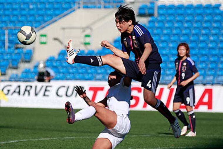 Japan became the first team in more than 3 years to hold the Americans scoreless. (Armando Franca/AP)