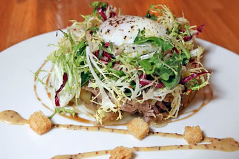 Lyonnaise Duck Salad. ( Steven M. Falk / Staff Photographer )