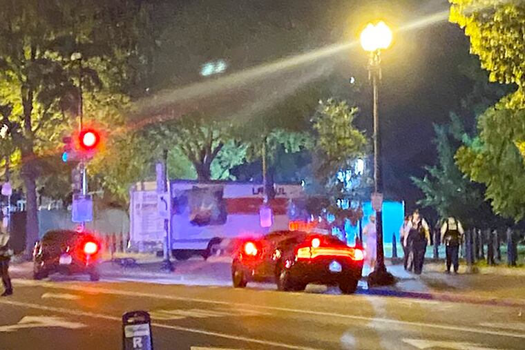 A box truck is seen crashed into a security barrier at a park across from the White House early Tuesday in Washington.