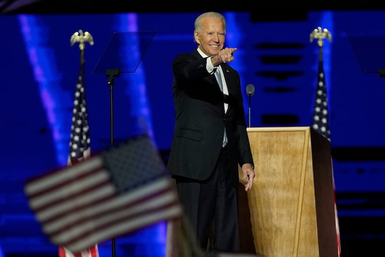 President-elect Joe Biden gestures on stage after speaking, Saturday, Nov. 7, 2020, in Wilmington, Del. (AP Photo/Andrew Harnik, Pool)
