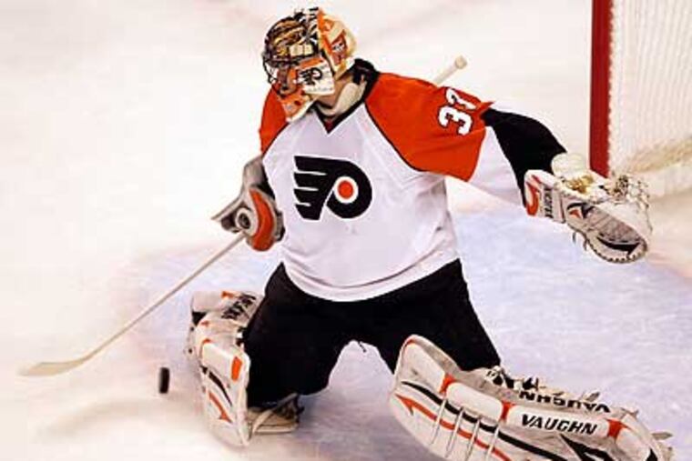 Brian Boucher makes a third period save against the Boston Bruins in Game 1. (Yong Kim / Staff Photographer)