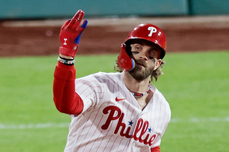 Phillies Bryce Harper rounds the bases after his solo home run in the fifth inning in Game 3 of a National League Division Series baseball game between the Atlanta Braves and the Philadelphia Phillies on Wednesday, Oct. 11, 2023, at Citizens Bank Park in Philadelphia.