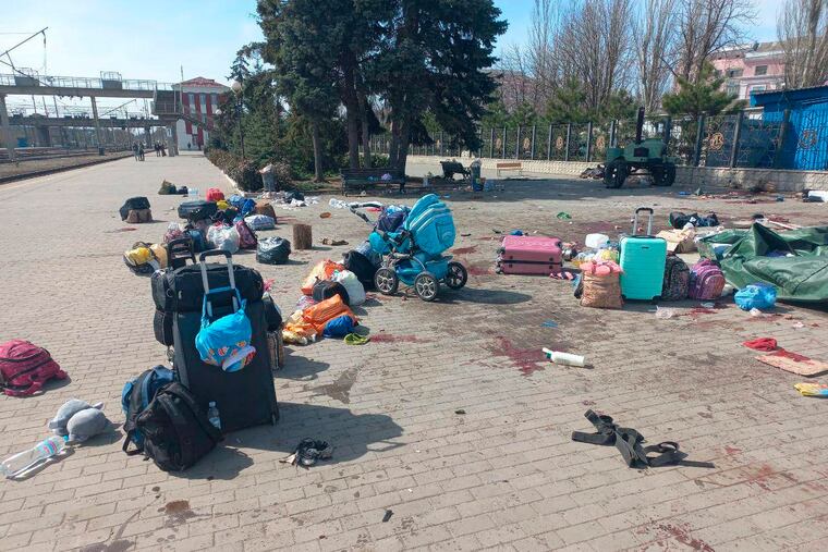 In this photo published on Ukrainian President Volodymyr Zelenskyy's Telegram channel, blood stains are seen among bags and a baby carriage on a platform after Russian shelling at the railway station in Kramatorsk, Ukraine, Friday, April 8, 2022.