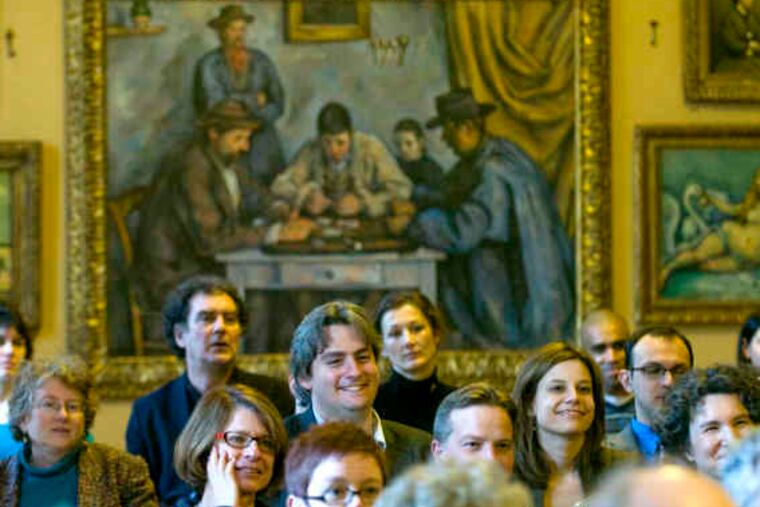 With Cezanne's "The Card Players" as a backdrop, scholars chuckle during a presentation at the Barnes Foundation. Center is Barnaby Wright of London's Courtauld Gallery.